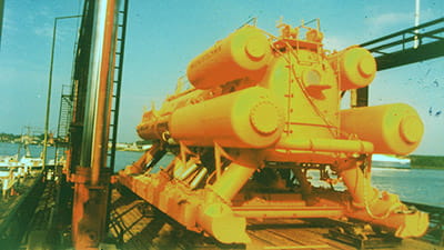 bright yellow structure on a ship ready to be lowered into the water