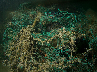 Tangled fishing nets on the sea floor