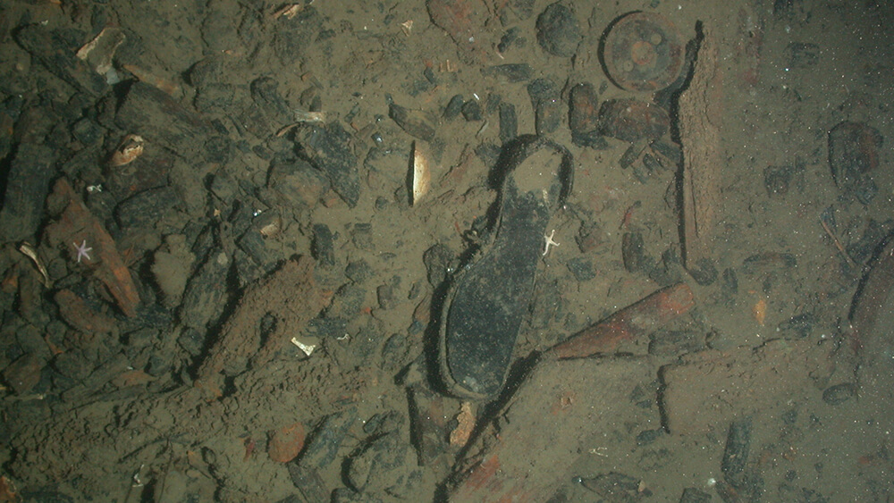 the sole of a shoe on the seafloor