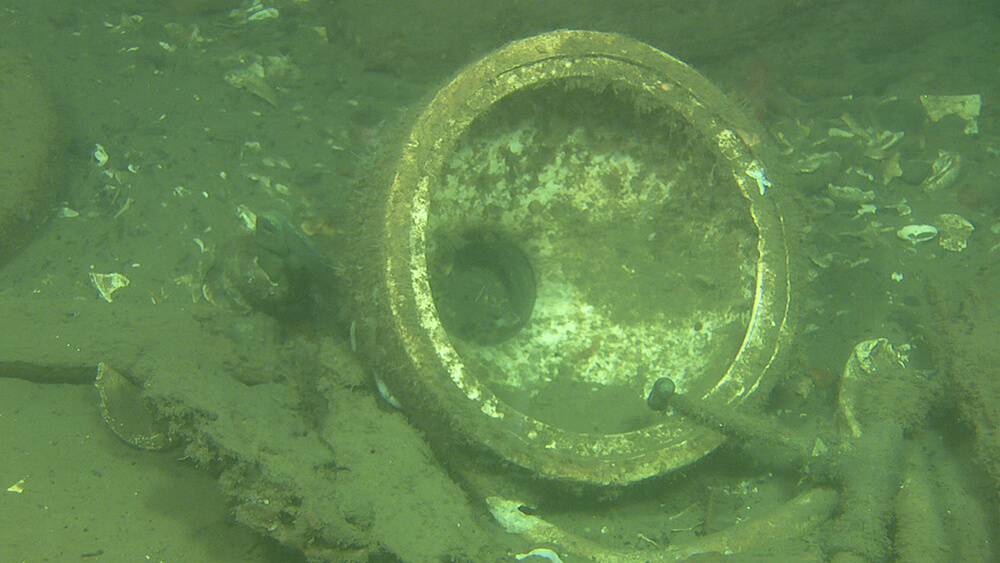 a toilet bowl on the seafloor
