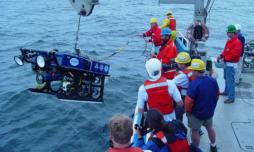 rov being deployed off of a ship