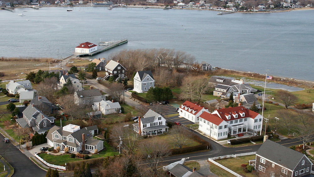 Aerial photo shows a modern view of the red-roofed buildings of the sanctuary campus