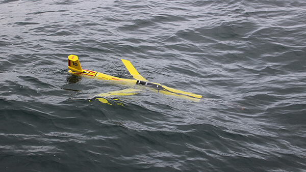 yellow acoustics glider in the water