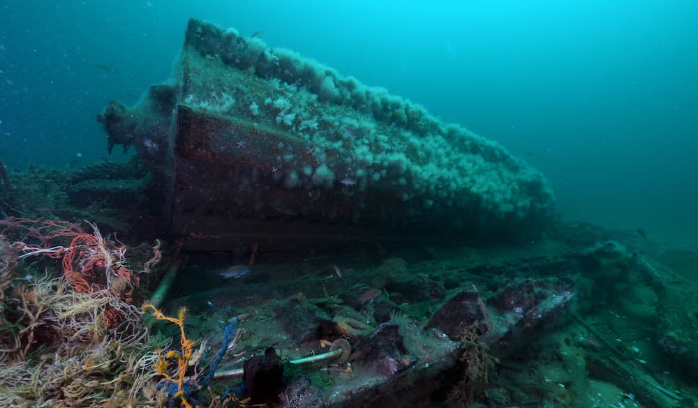Heroic, a former minesweeper turned fishing vessel, as a shipwreck at the bottom of the ocean